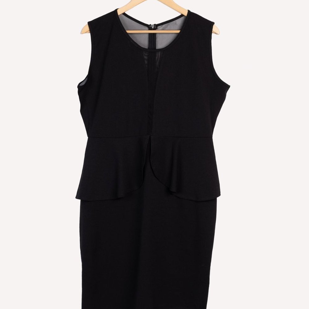 Mesh see-through sleeveless peplum dress.